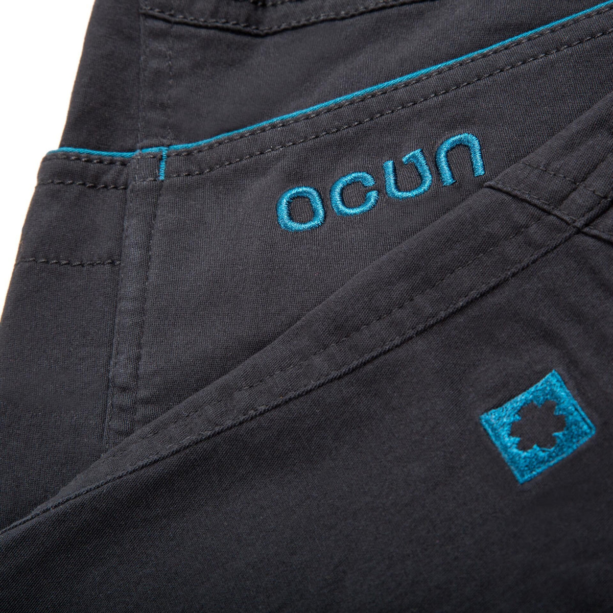 Ocun Jaws Climbing | Bouldering Pant Black Caviar - pocket and embroidery close up - The Climbing Shop